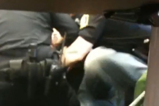 Foster as she is being arrested by three officers at the University of Wisconsin, Milwaukee / United States