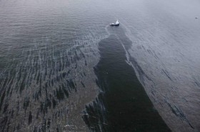 Crude Oil poring out of the demolished oil rig at the Gulf Of Mexico