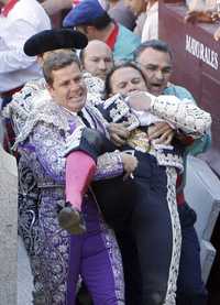 matador being carried after horrific injury