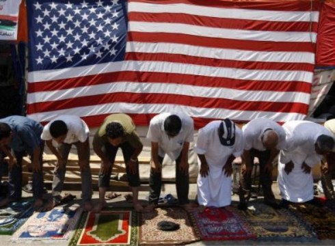 Life in Libya returns slowly to ' normal '. Friday prayers in Libya in front of flags from 'Liberators'