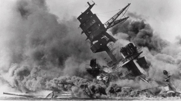 In this Dec. 7, 1941, file photo, the battleship USS Arizona belches smoke as it topples over into the sea during a Japanese surprise attack on Pearl Harbor, Hawaii. Wednesday is the 70th anniversary of the attack that brought the United States into the Second World War.