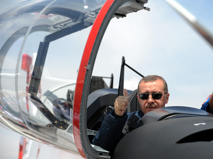 Erdogan sits in the cockpit of Hürkus, the first Turkish aircfraft produced in Turkey