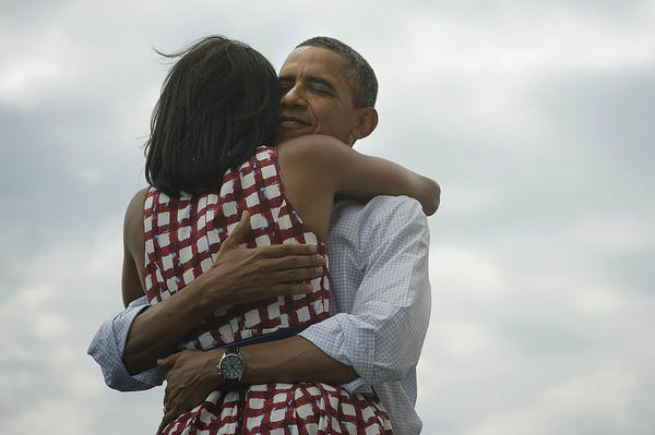 Relected US President Barack Obama's first deed after his victory over Romney was to hug his dear wife Michelle